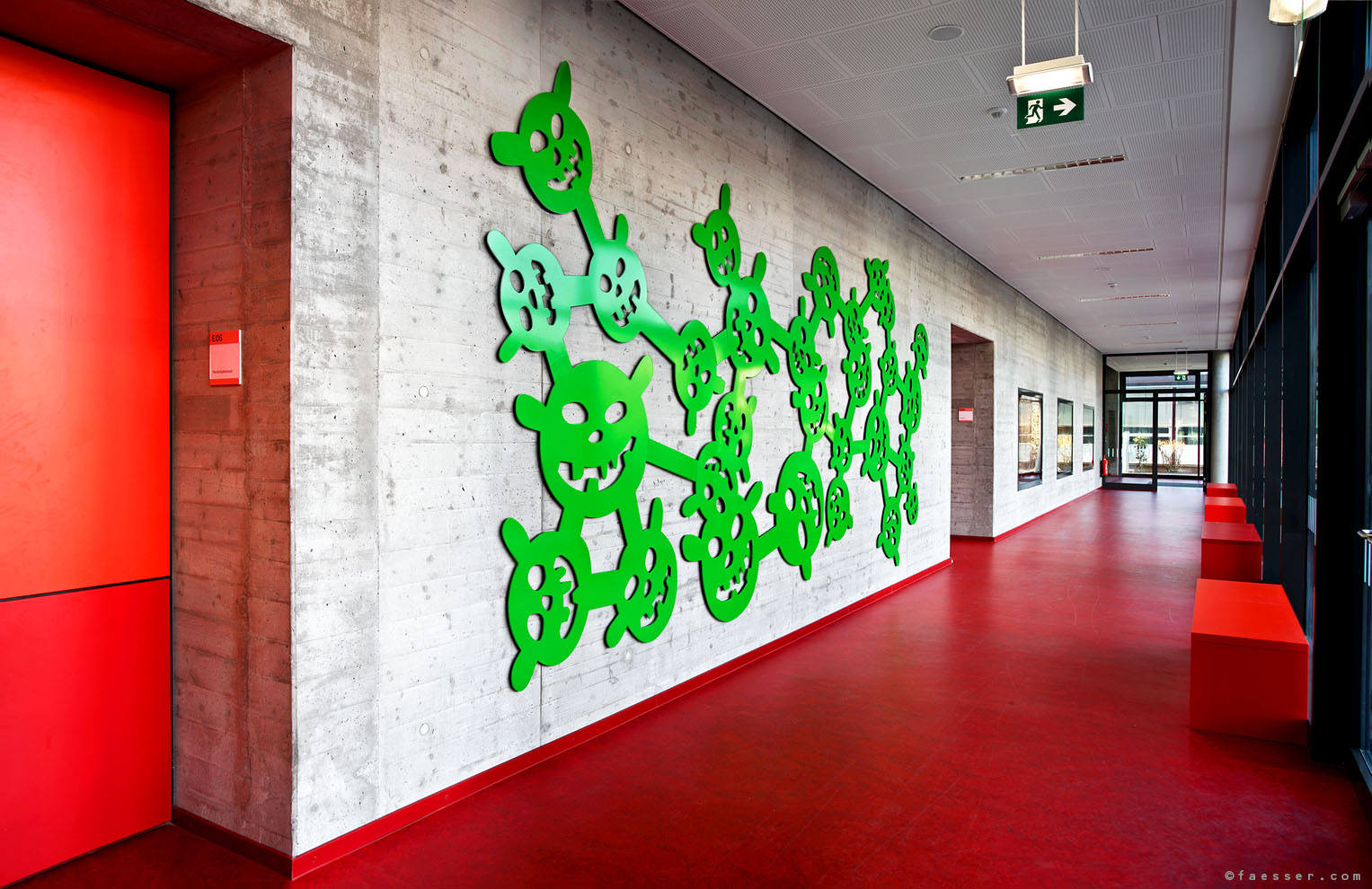 29 sheet steel goblin heads as narrative wall figures; artist Roland Faesser, sculptor and painter 2010