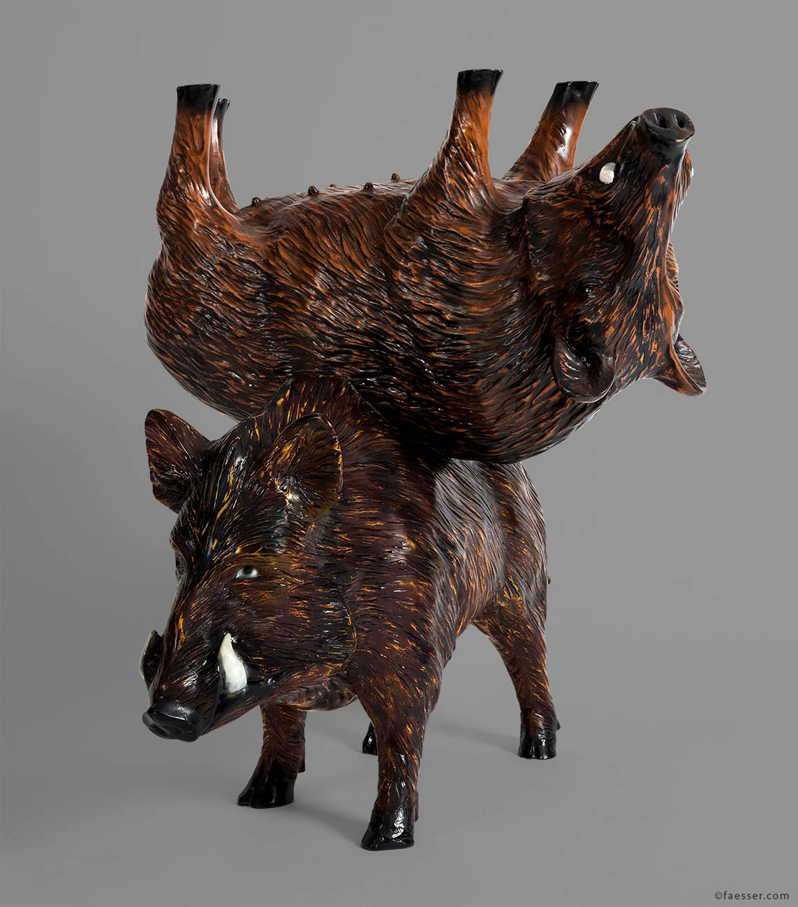 Piggyback: Two boars shouldered back to back in upside down position; work of art as figurative sculpture; artist Roland Faesser, sculptor and painter 2006