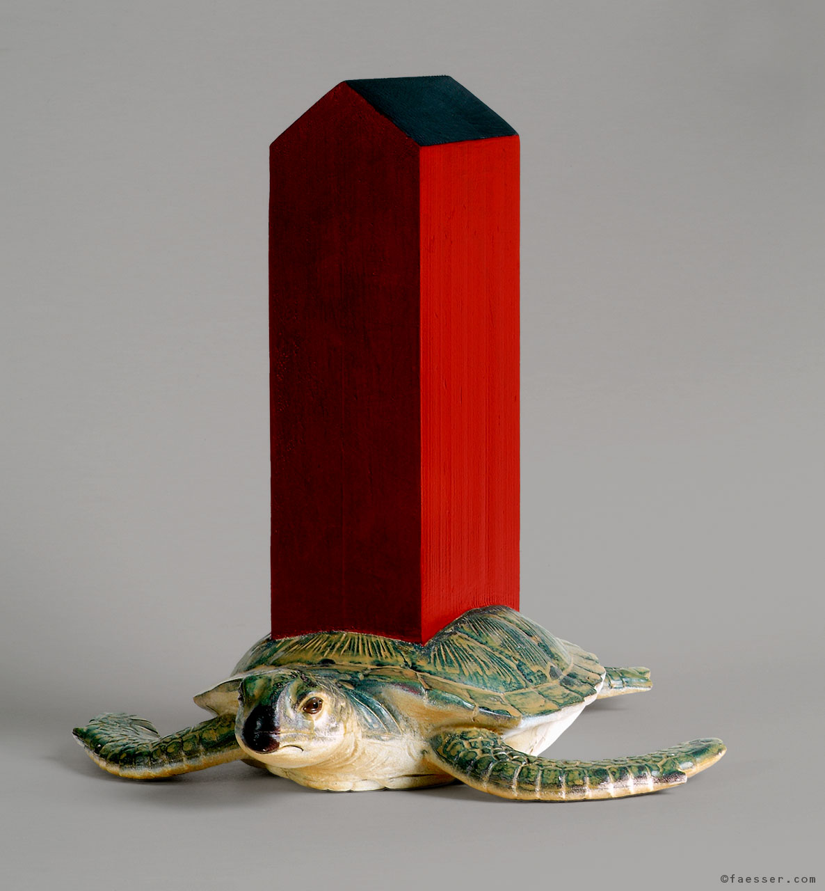 A turtle is carrying a house on his shell; artist Roland Faesser, sculptor and painter 1998