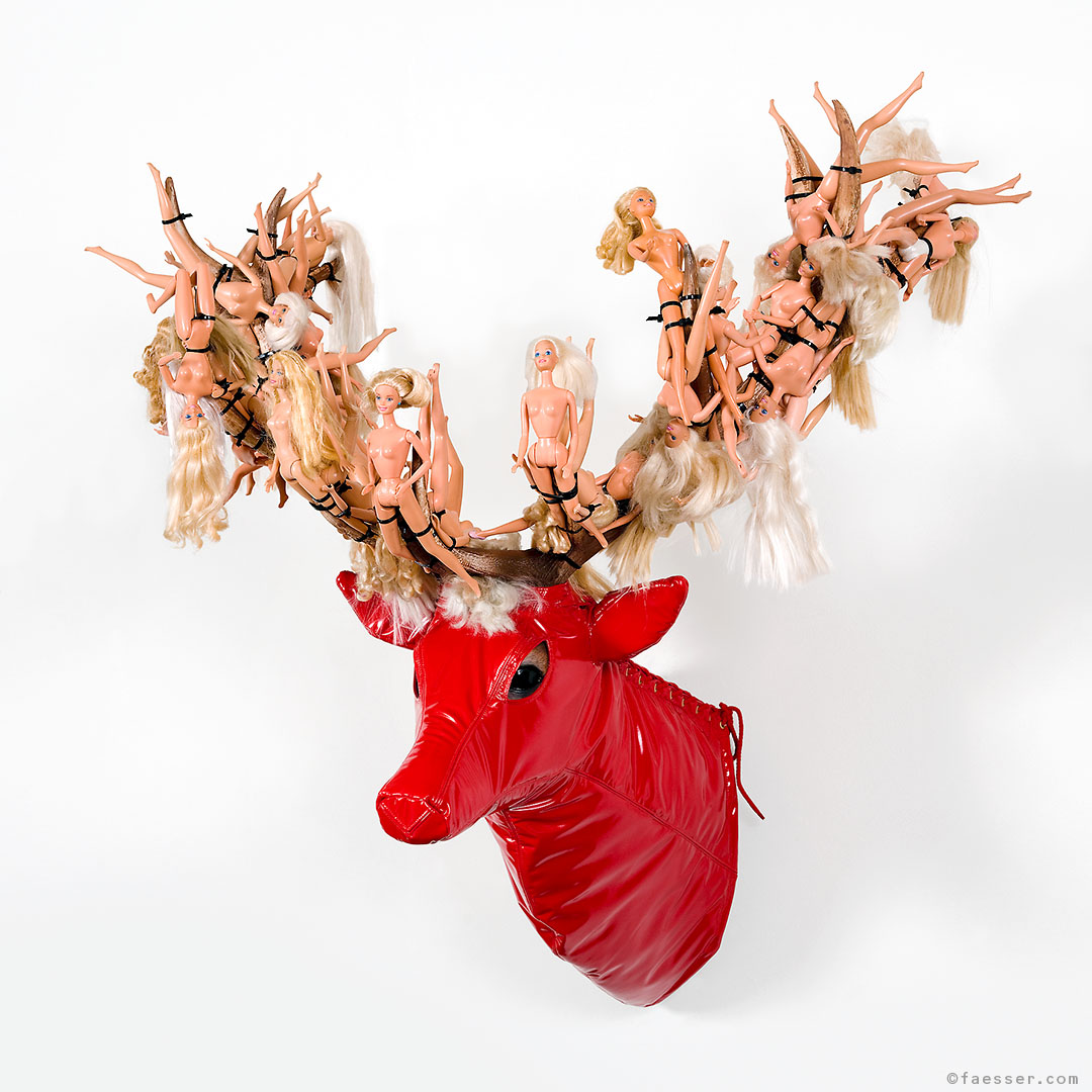 Not In The Wildest Dreams: varnished masked trophy with naked barbies; work of art as figurative sculpture; artist Roland Faesser, sculptor and painter 2008
