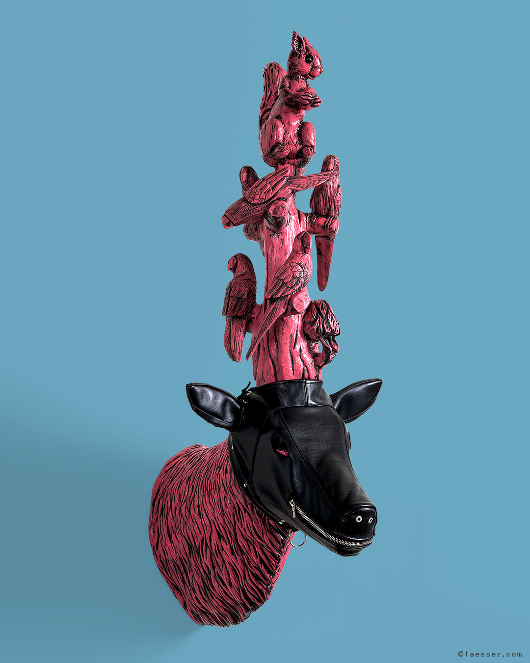 A Little Bird Told Me, black leather mask trophy with zipper and singing birds with squirrel; work of art as figurative sculpture; artist Roland Faesser, sculptor and painter 2008