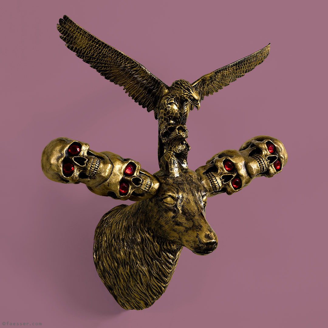 Diamonds Are Forever, golden deer trophy with skulls, red diamonds and eagle; work of art as figurative sculpture; artist Roland Faesser, sculptor and painter 2008