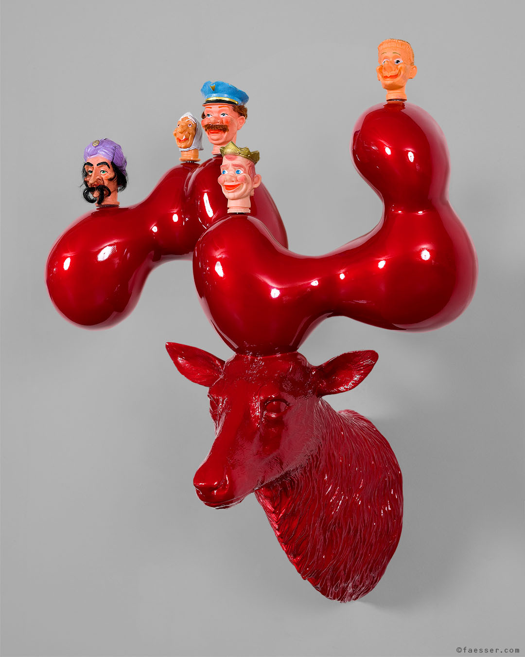 Who Has Stolen Grandma's Pancakes, high glossy abstract deer trophy with fool puppet figures; work of art as figurative sculpture; artist Roland Faesser, sculptor and painter 2007